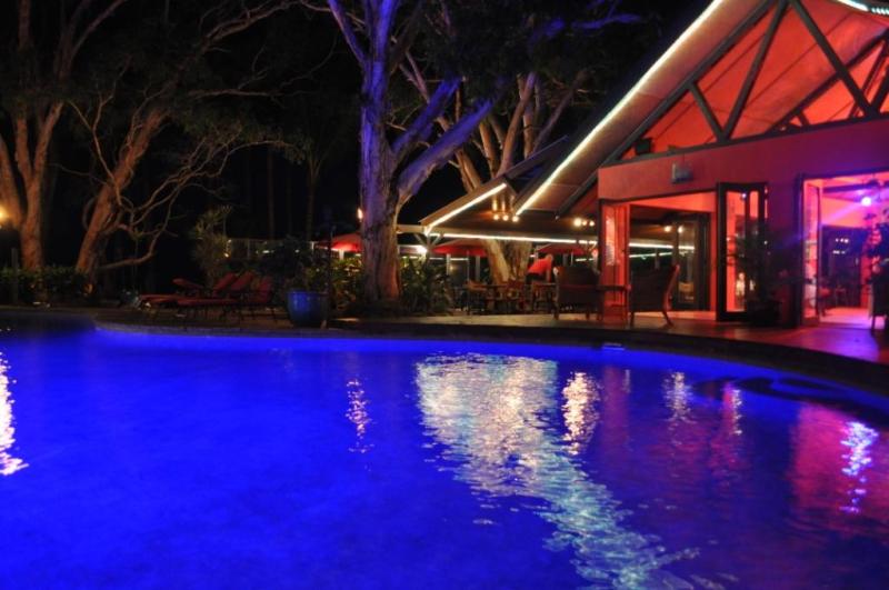 Pool & Sandbar restaurant at night - Turtle Cove Beach Resort