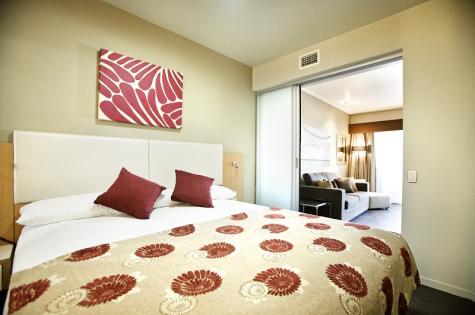 One Bedroom Apartment Bedroom - The Grand Hotel Townsville