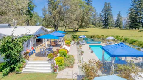 a bird's eye view of the villa and pool
- Sunset Villa