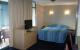 Room
 - AAA Airport Albion Manor Apartments and Motel