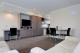 living room of the two bedroom apartments
 - Auckland Airport Lodge