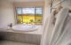 Large dual person spa in the spacious bathroon
 - Azjure Studio Retreat