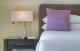 King size pillow-top Sealy Posturepedic bed with crisp white linen
 - Azjure Studio Retreat