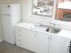 side B of 1 bedroom apt FULL kitchen with large fridge and plenty of storage spc
 - Drummond Serviced Apartments Carlton