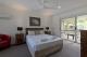 A master bedroom
 - A Tropical Nite Holiday Townhouses