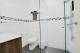 Queen room bathroom
 - Castle Creek Motel