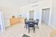 2 Bedroom Family Apartment kitchen and dining
 - COAST Motel and Apartments