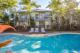View across pool - Coral Beach Noosa Resort