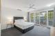 Master bedroom with balcony
 - Coral Beach Noosa Resort