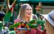 Woman feeding lorikeets
 - Astra Lumina Night Walk at Currumbin Wildlife Sanctuary Currumbin Wildlife Sanctuary