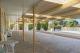 Under cover carport for Standard Motel Rooms.
 - Econo Lodge Alabaster Motel