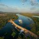 Flying over Lake Kununurra Diversion Dam
 - Capture the Cockburn Range & King River - KH90C HeliSpirit