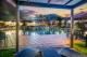 Poolside at dusk
 - Hotel Grand Chancellor Palm Cove