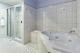 Executive Spa Unit Bathroom
 - Olde Tudor Hotel