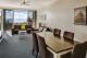 2 bedroom ocean view living and dining area
 - On the Beach Holiday Apartments