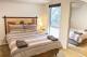 Master Bedroom In The Two-Bedroom Apartment
 - One of a Kind Apartments