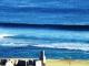 Surfing out front zoomed in
 - Panorama Seaside Apartments