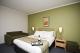 Queen Bed
 - The Woden Hotel