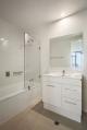 Three Bedroom Apartment Bathroom
 - Quest on Franklin
