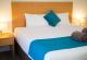 6-1 2BR King bed at an angle
 - Sunnybank Star Hotel and Apartments