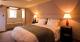 bedroom interior
 - The Priory Country Lodge