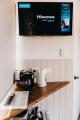 TV above tea coffee - Toogunna Plains Farmstay
