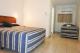 Self-Contained Apartment Bedroom
 - Tropic Coast Motel