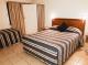 Self-Contained Apartment Bedroom
 - Tropic Coast Motel